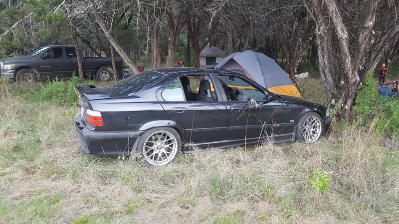 One of the great all-rounders - the first M3 sedan - doing what any self-respecting all-rounder does; going camping.
